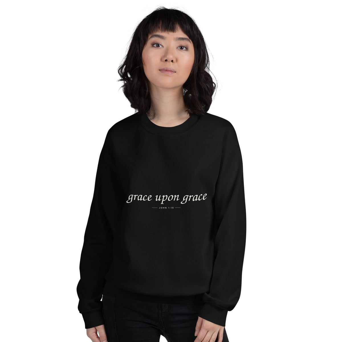 Grace Upon Grace Christian unisex crewneck sweatshirt in Black, front view on women's model