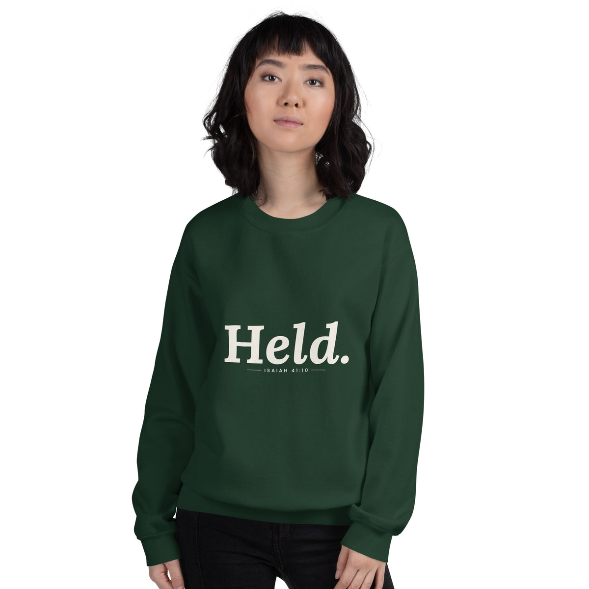 Held. Christian unisex crewneck sweatshirt in Forest Green, front view on women's model