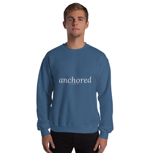 Anchored Christian unisex crewneck sweatshirt in Indigo Blue, front view on model