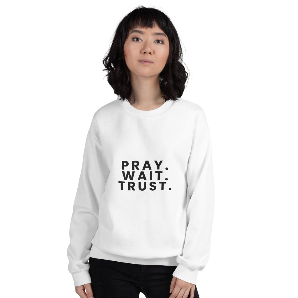 Pray. Wait. Trust. Christian unisex crewneck sweatshirt in White, front view on women's model