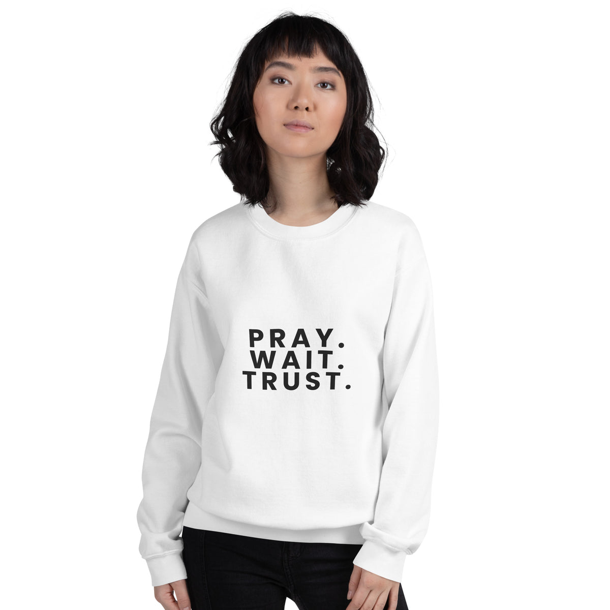 Pray. Wait. Trust. Christian unisex crewneck sweatshirt in White, front view on women's model