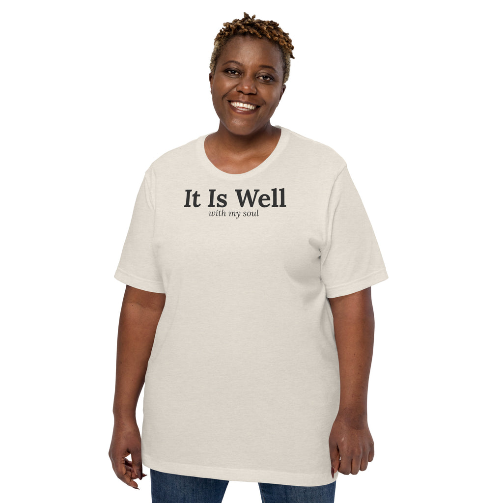 It Is Well Christian unisex tee in Heather Dust, front view on women's model