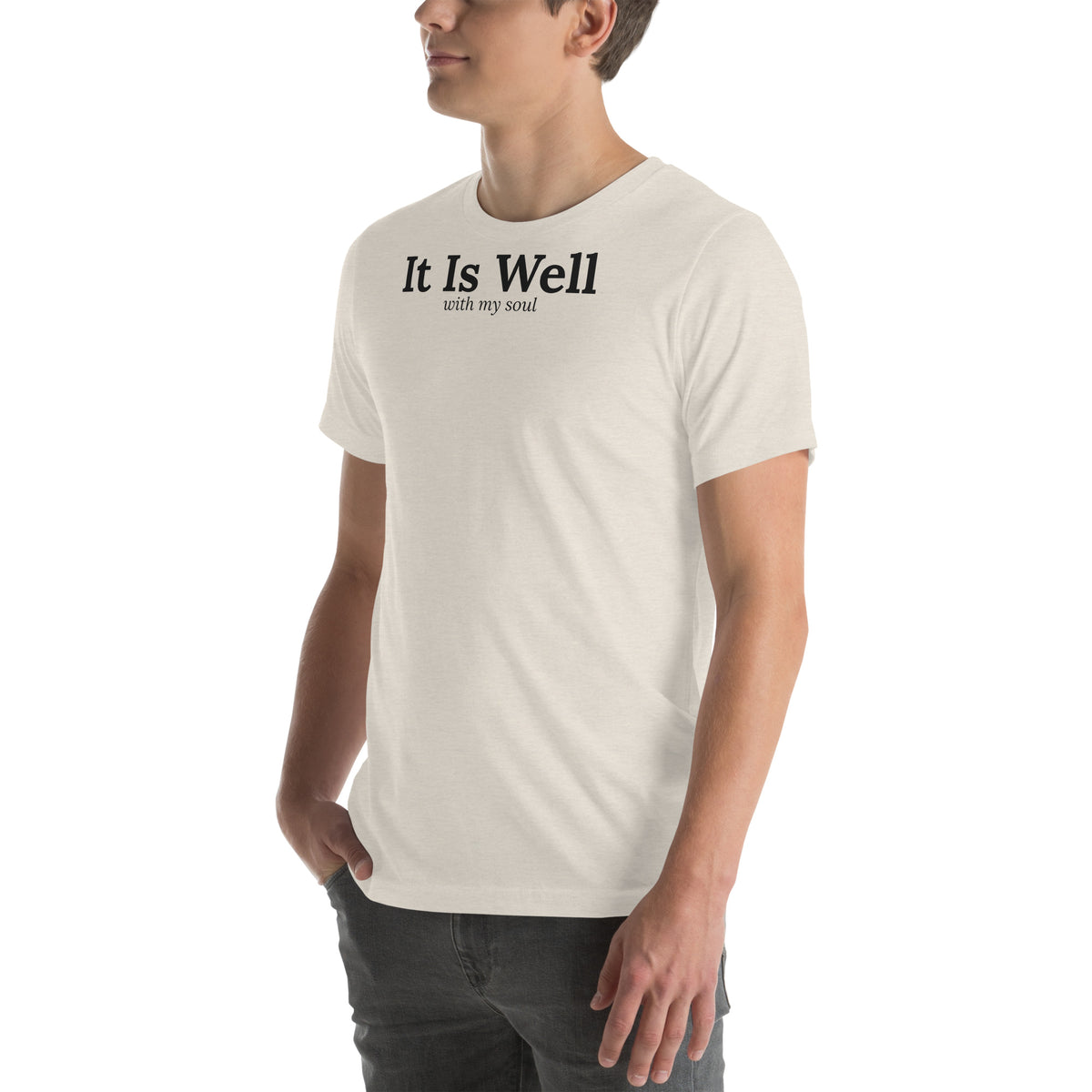 It Is Well Christian unisex tee in Heather Dust, left-front view on model