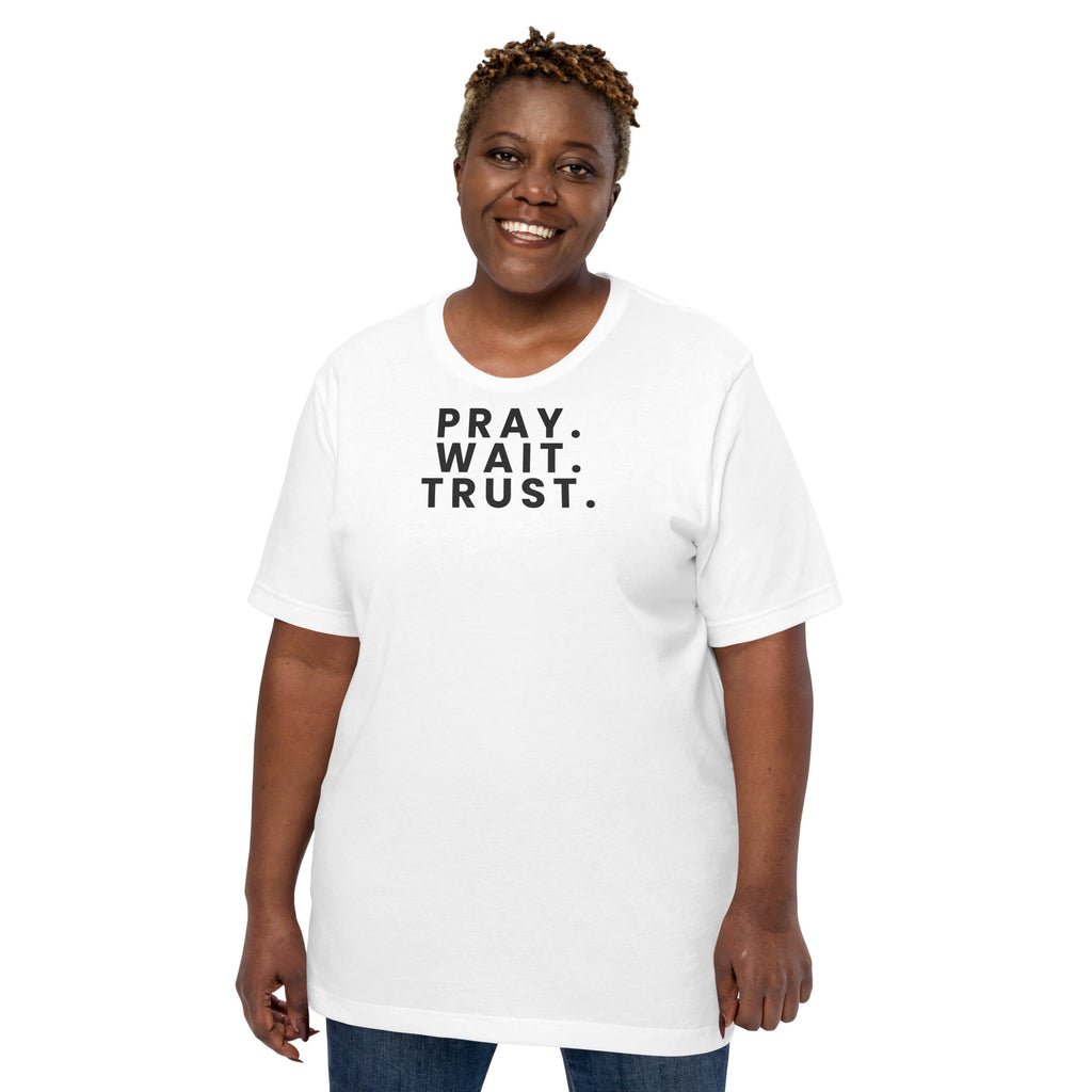 Pray. Wait. Trust. Christian unisex tee in White, front view on women's model